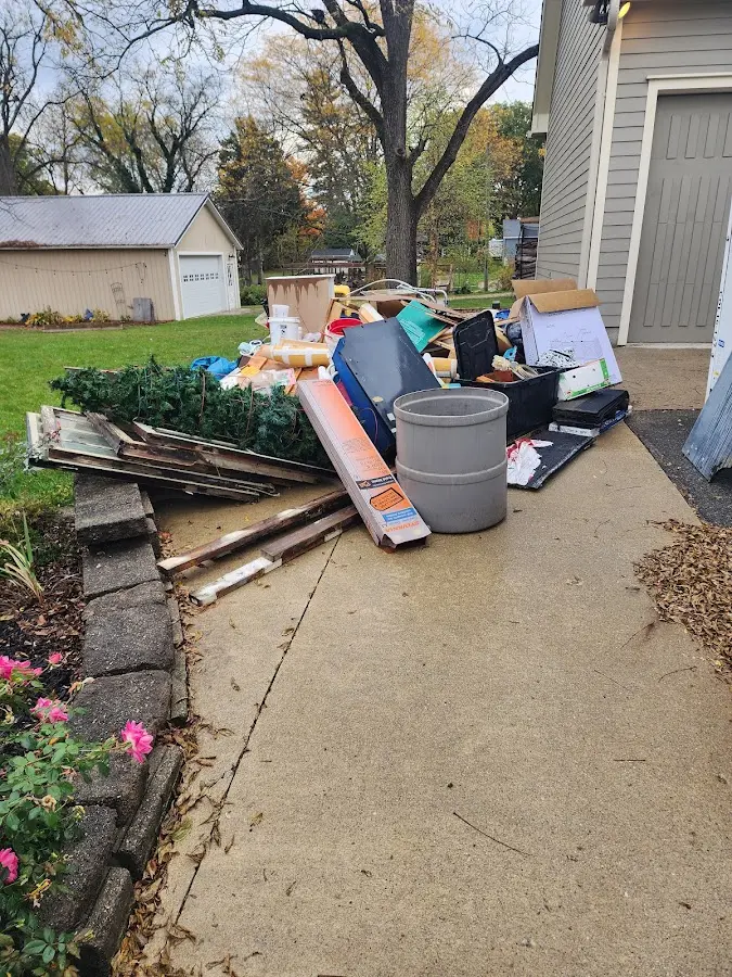 Dumpster being loaded with debris for 12 Yard Dumpster Rental in Cicero
